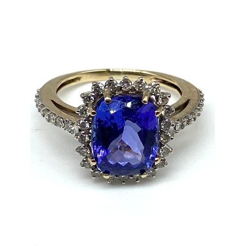 54 - A 9ct yellow gold triple A tanzanite & diamond ring, ring has been sized an dlost hallmark, weight i... 