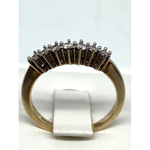 57 - A 9ct yellow gold diamond eternity ring, size N, 2.4 grams in weight approx, approx 0.25ct diamonds,