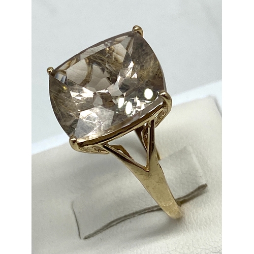 63 - A 9ct yellow gold dress ring, large centre stone is 15mm x 15mm, 4.2 grams approx weight, size N