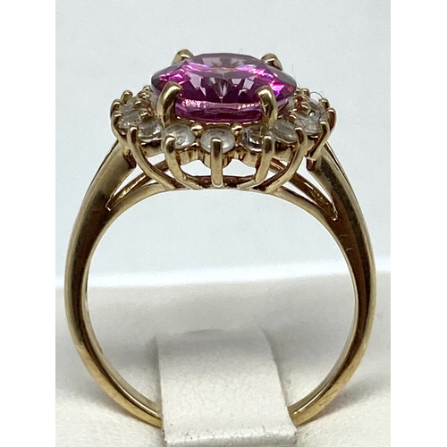 65 - A 9ct yellow gold dress ring, pink/red coloured stone, 3.7 grams approx weight, size N