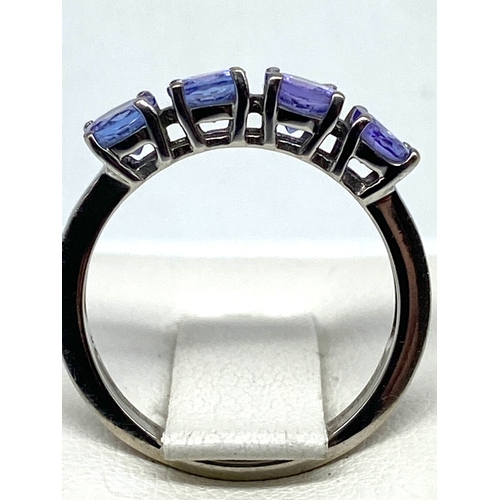 68 - A 9ct white gold tanzanite dress ring, set with 4 tanzanite stones, size J, 2.1 grams in weight appr... 