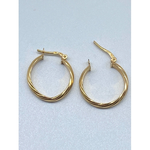 7 - A pair of 9ct yellow gold hoop earrings, 15mm size, 1.1 grams in weight approx