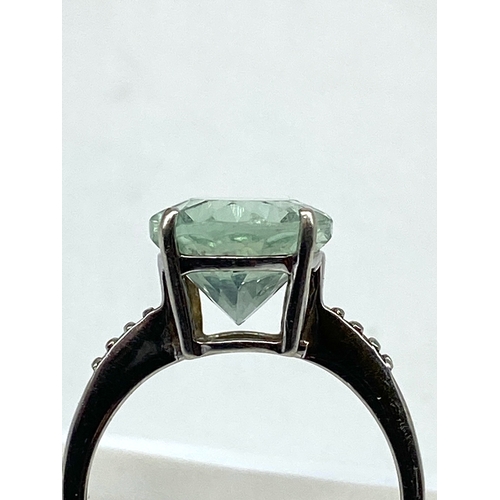 71 - A 9ct yellow gold dress ring, large centre green stone, weight is 3.2 grams approx, size N