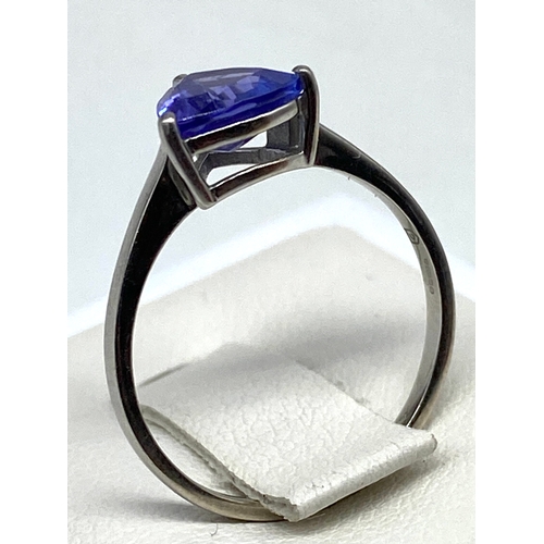 66 - A platinum & tanzanite dress ring, approx 1ct triangle shaped tanzanite, 2.4 grams approx weight, si... 