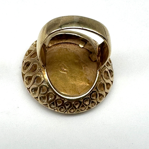 76 - A 22ct yellow gold full sovereign coin in a 9ct yellow gold ring mount, total weight 15.6 grams