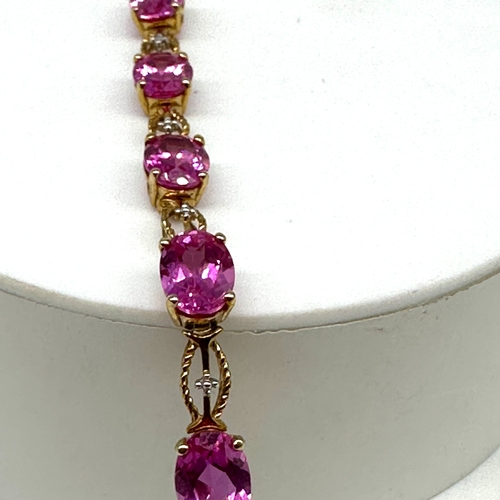 85 - A 10ct yellow gold pink stone bracelet, approx weight is 9.4 grams, 7 1/2 inches long