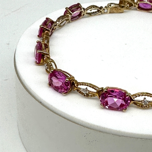 85 - A 10ct yellow gold pink stone bracelet, approx weight is 9.4 grams, 7 1/2 inches long