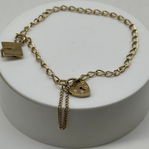 80 - A 9ct yellow gold charm bracelet, charm is a graduation cap