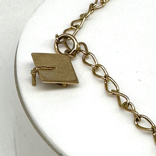 80 - A 9ct yellow gold charm bracelet, charm is a graduation cap