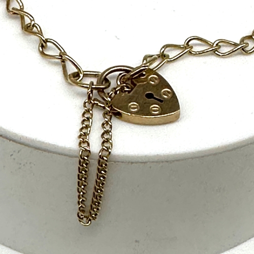 80 - A 9ct yellow gold charm bracelet, charm is a graduation cap