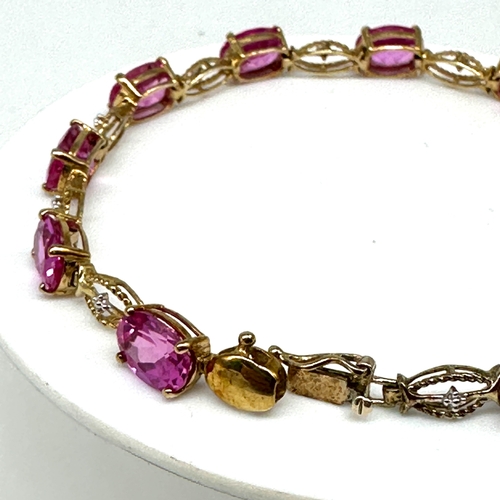 85 - A 10ct yellow gold pink stone bracelet, approx weight is 9.4 grams, 7 1/2 inches long