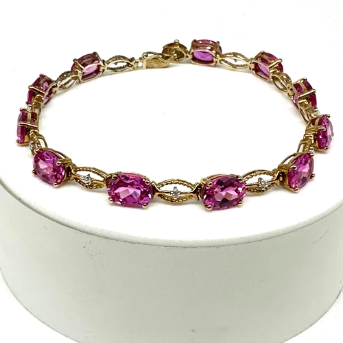 85 - A 10ct yellow gold pink stone bracelet, approx weight is 9.4 grams, 7 1/2 inches long