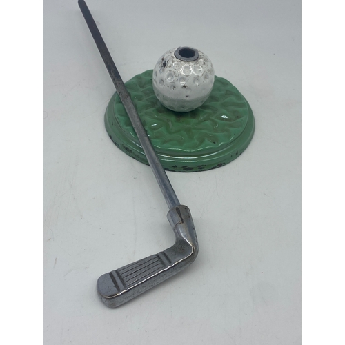 244 - Golf ball & club metal poker set, 14 1/2 inches high x 5 inch diameter