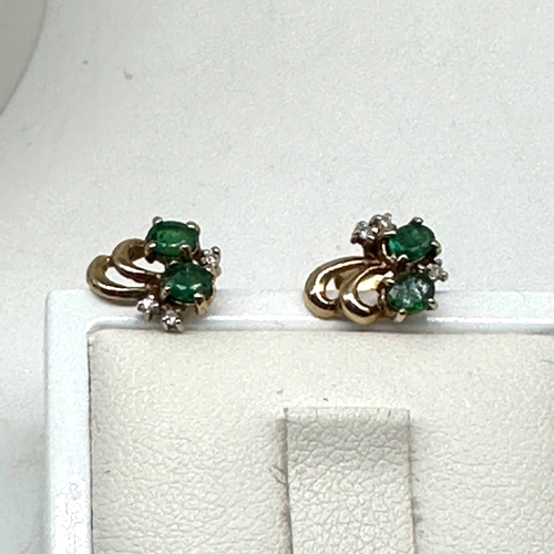 94 - A pair of 9ct yellow gold emerald & diamond stud earrings, 1.4 grams approx weight