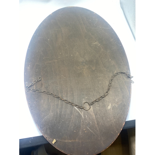 238 - An oak oval mirror, approx 70cm x 45cm, buyer to collect or arrange shipping and packing