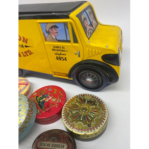 394 - A collection of tins, including William Morris van