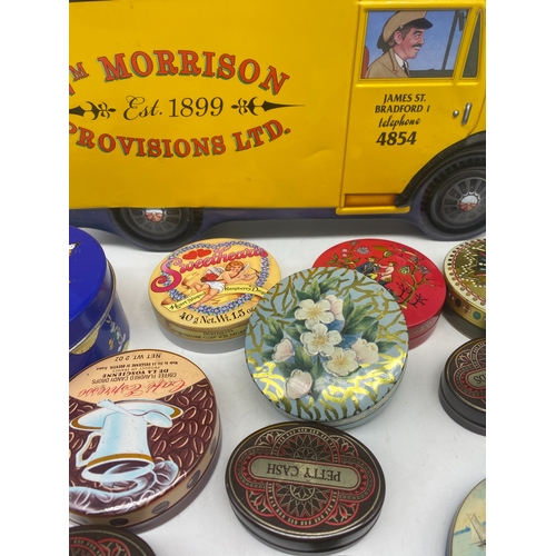 394 - A collection of tins, including William Morris van