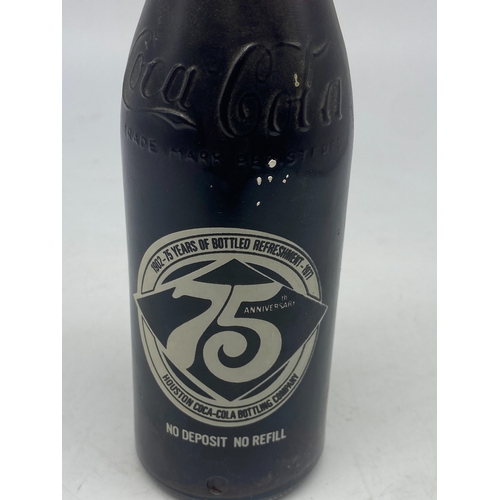 404 - A vintage coke cola bottle, original cola inside, 10floz