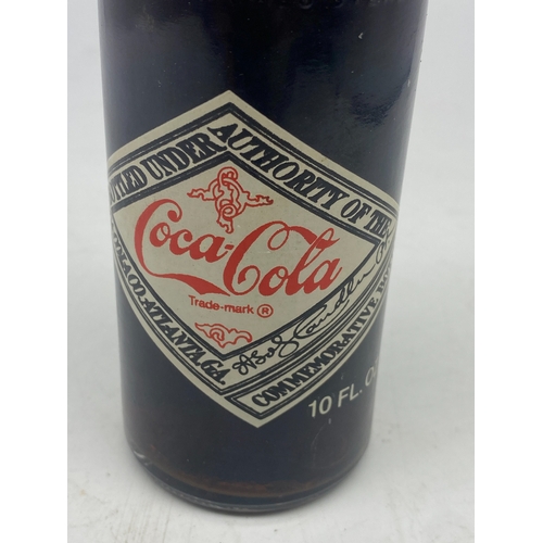 404 - A vintage coke cola bottle, original cola inside, 10floz