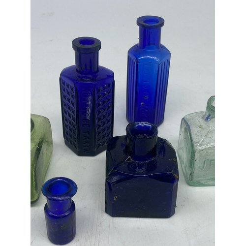 416 - A collection of mini Victorian glass bottles