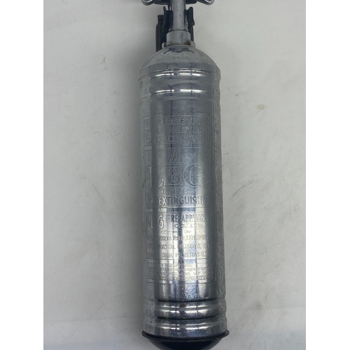 421 - A chrome vintage fire extinguisher