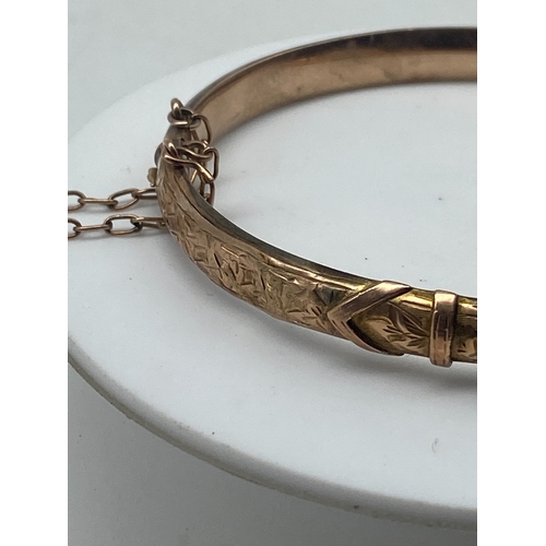 95 - A 9ct rose gold Victorian bangle, has a safety chain, 6 grams approx weight, semi hollow bangle