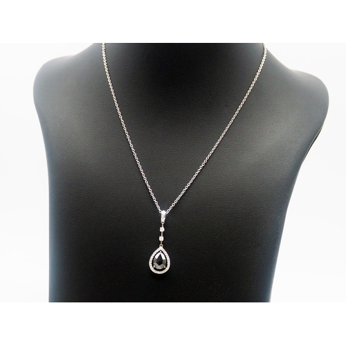 485 - An 18ct White Gold Pear Shape Black Diamond Pendant, 18ct Chain = 16