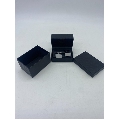 490 - A pair of stainless steel cufflinks