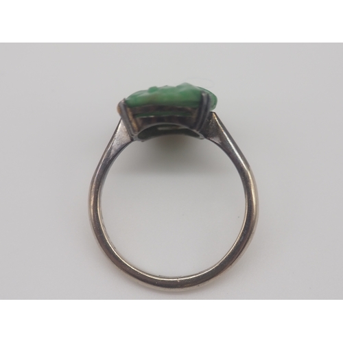 503 - A 9ct white gold carved jadeite dress ring, 3.2g approx weight,