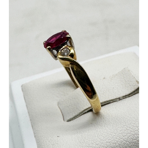 509 - A 18ct yellow gold Ruby & diamond ring, size J, in very good condition