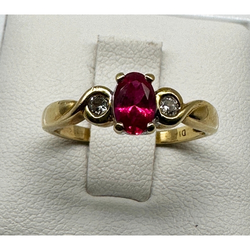 509 - A 18ct yellow gold Ruby & diamond ring, size J, in very good condition