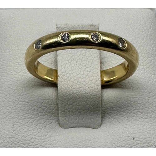 510 - An 18ct yellow gold diamond band
in good condition
size J