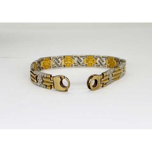 512 - A 9ct yellow gold diamond set bracelet with white gold links, 7 1/2 inches long and 8mm wide, weight... 