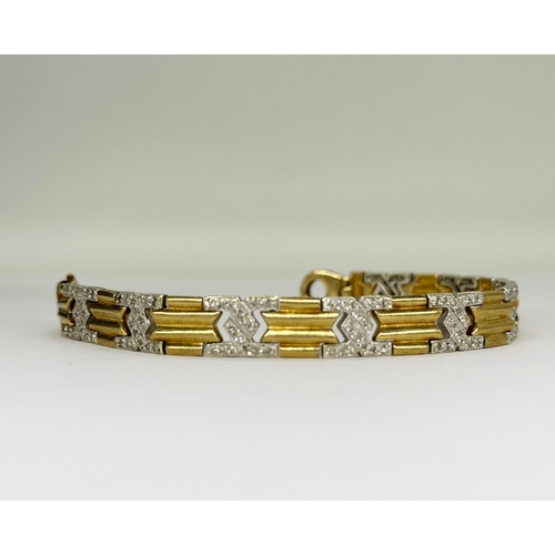 512 - A 9ct yellow gold diamond set bracelet with white gold links, 7 1/2 inches long and 8mm wide, weight... 