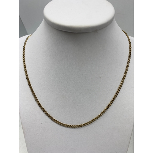 522 - A 9ct yellow gold curb chain, 9.5 grams in weight approx, 21 inches long, in good condition