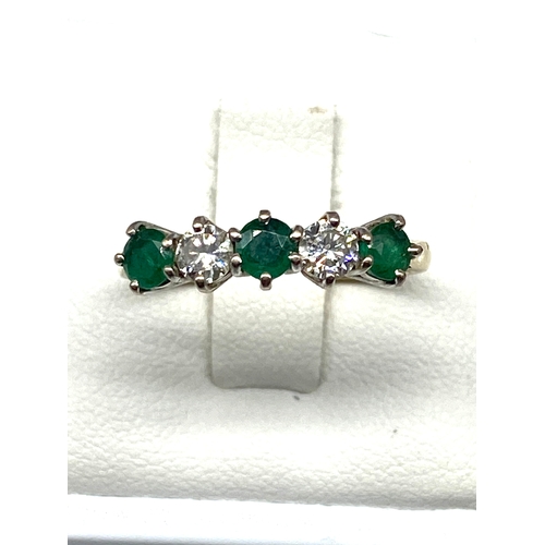 523 - An 18ct yellow gold emerald & diamond dress ring, diamonds approx 0.50ct, emeralds are 0.60ct approx... 