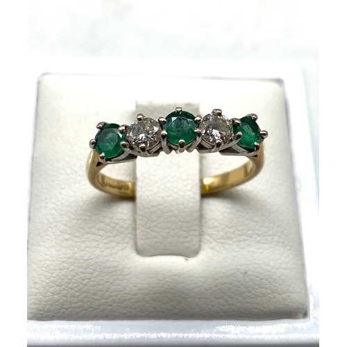 523 - An 18ct yellow gold emerald & diamond dress ring, diamonds approx 0.50ct, emeralds are 0.60ct approx... 