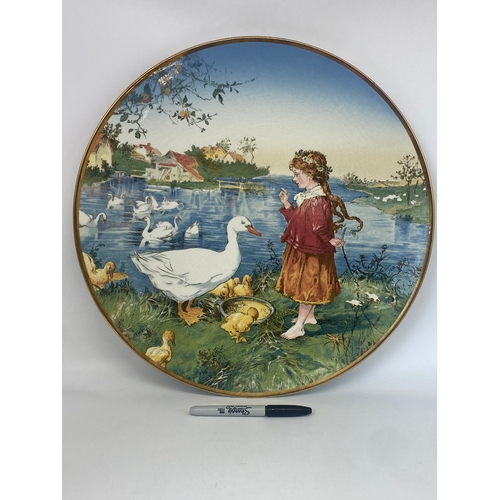 513 - A Villeroy Boch Mettlach large wall plate, kiln cracked all over