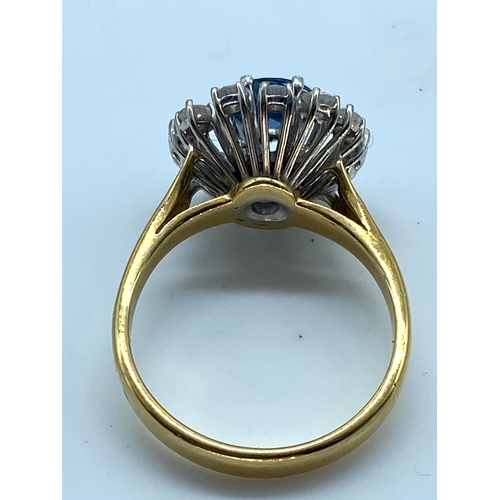 11 - An 18ct yellow gold sapphire and diamond fancy dress ring, sapphire is very clean with a great colou... 