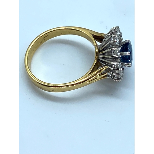 11 - An 18ct yellow gold sapphire and diamond fancy dress ring, sapphire is very clean with a great colou... 