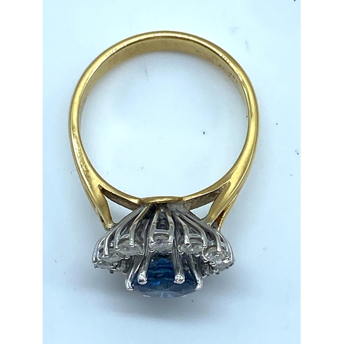 11 - An 18ct yellow gold sapphire and diamond fancy dress ring, sapphire is very clean with a great colou... 