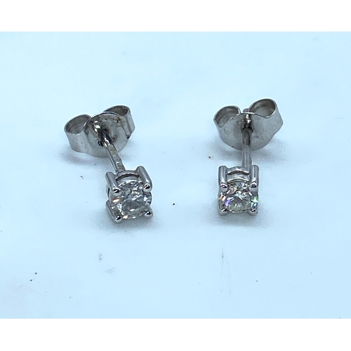 14 - A pair of 18ct white gold diamond stud earrings, approx combined weight 0.40ct of diamonds, in very ... 