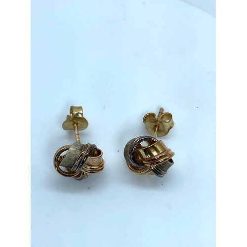 15 - A pair of 9ct tri-coloured stud earrings, knot design, 2.6 grams approx combined weight, in nice con... 