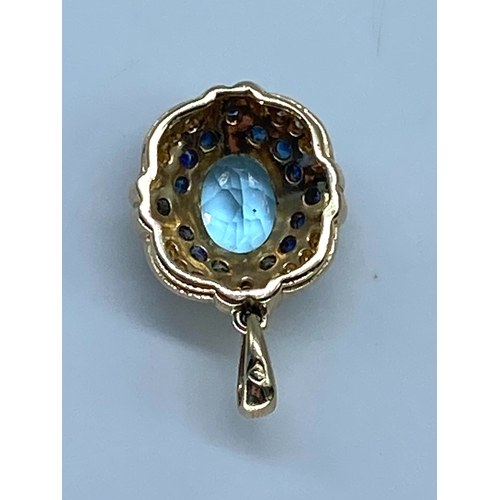 173 - A 9ct yellow gold topaz/sapphire & diamond pendant no chain, 24mm x 14mm, weight is 3.9 grams approx