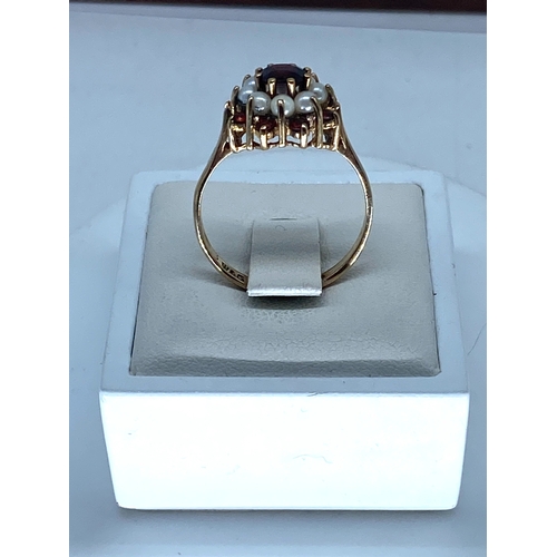 175 - A 9ct yellow gold garnet & pearl dress ring, size P, 2.8 grams on weight approx