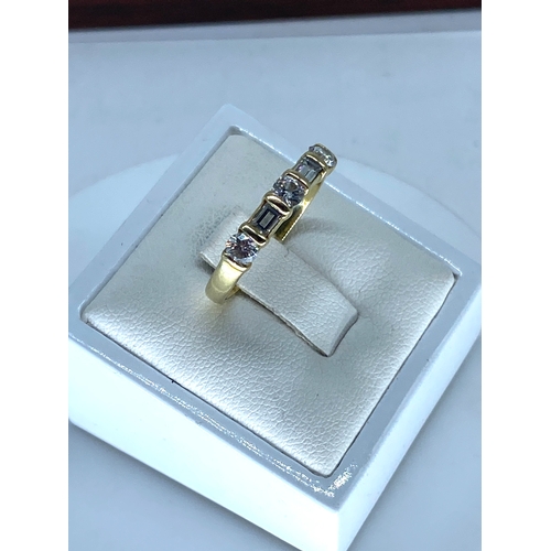 178 - An 18ct yellow gold emerald cut diamond ring, size Q, weight is 2.8 grams approx, set with 3 brillia... 