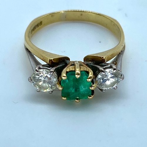 18 - An 18ct yellow & white gold shoulder emerald & diamond dress ring, very nice emerald stone with good... 