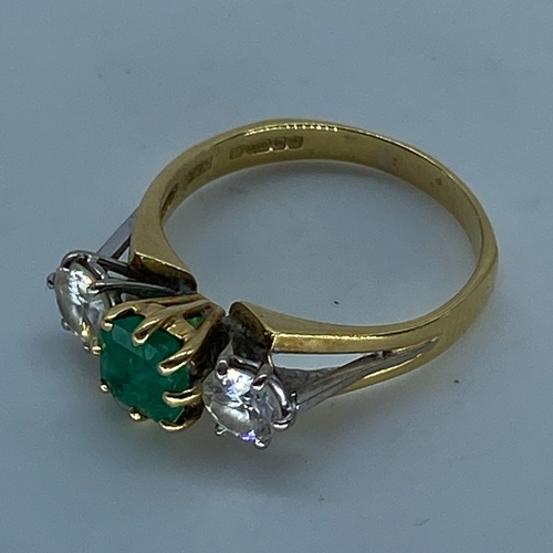 18 - An 18ct yellow & white gold shoulder emerald & diamond dress ring, very nice emerald stone with good... 