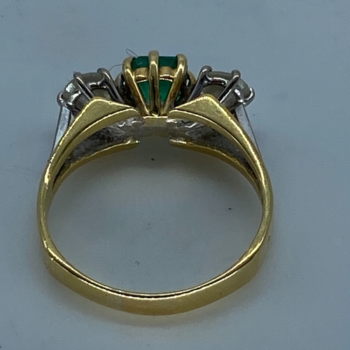 18 - An 18ct yellow & white gold shoulder emerald & diamond dress ring, very nice emerald stone with good... 