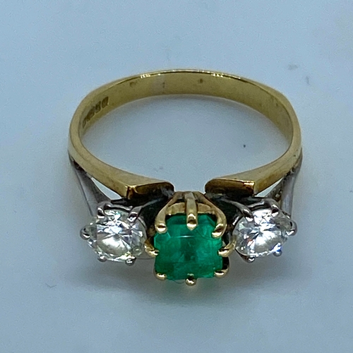 18 - An 18ct yellow & white gold shoulder emerald & diamond dress ring, very nice emerald stone with good... 